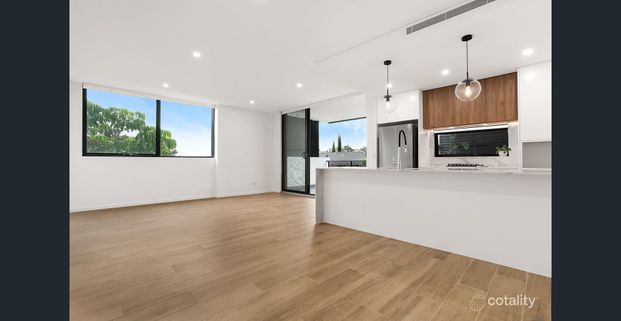 Modern Two-Bedroom Apartment with Stunning District Views - Photo 1