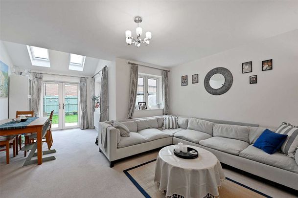 Situated in a peaceful location with open green space to the front, this spacious family home is arranged over three floors and offers well-presented accommodation throughout. - Photo 1