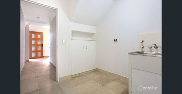 Spacious Townhouse with Solar and Water Included - Photo 1