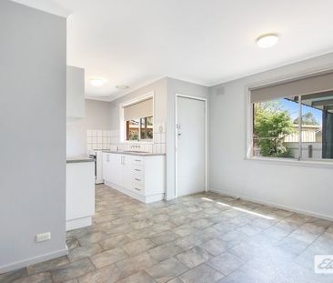 Charming 3-Bedroom Home with Modern Comforts & Outdoor Storage - Photo 5