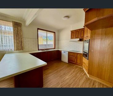 Spacious Family Home with Secure Yard and Ample Parking - Photo 4