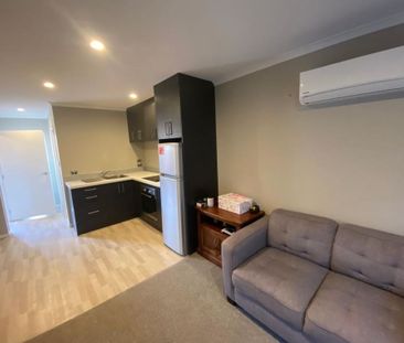 A modern, fully furnished, upstairs studio room is available! - Photo 5