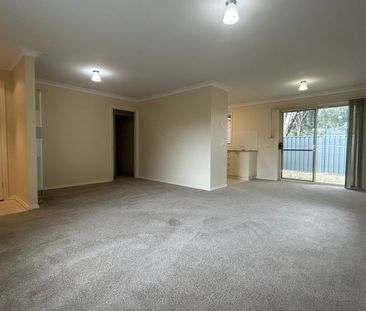 COMFORTABLE TWO-BEDROOM TOWNHOUSE IN A CONVENIENT LOCATION - Photo 1