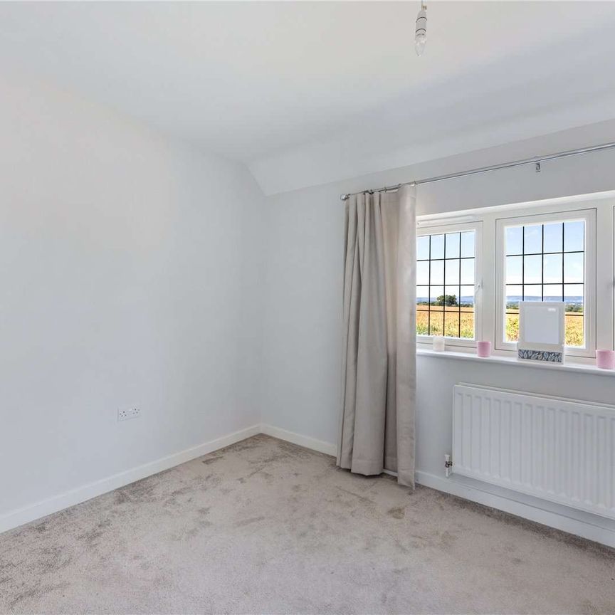 Charming mid-terrace home offering versatile living space, private garden, off-street parking and car port - Photo 1
