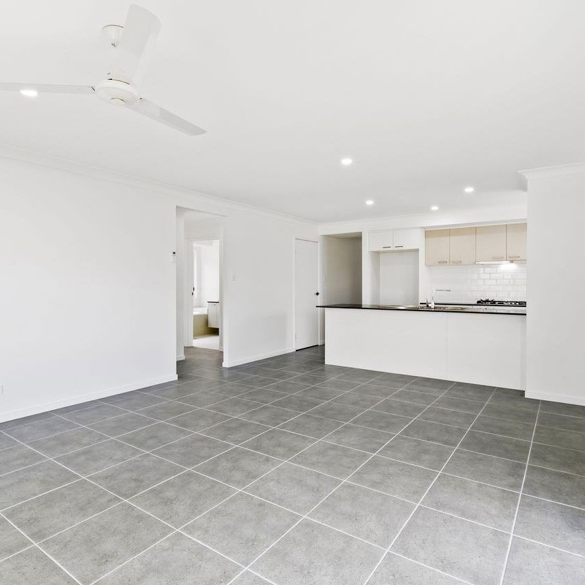 YOUR NEW FAMILY HOME AWAITS YOU! - Photo 1