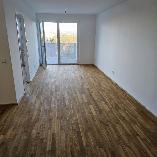 Neubau-Erstbezug mit Balkon, Fernblick & Top-Anbindung in Simmering - Photo 1