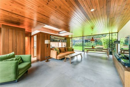 Nestled within a prestigious secluded private road in Blackheath, this striking family home stands as a testament to contemporary luxury and sustainability. Spanning 1197 square feet. - Photo 2