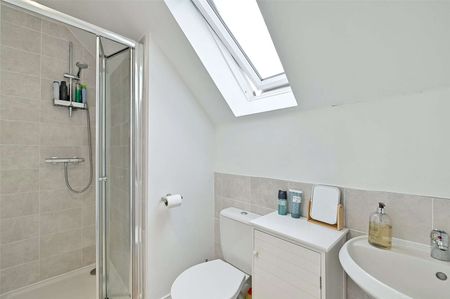 Situated in a peaceful location with open green space to the front, this spacious family home is arranged over three floors and offers well-presented accommodation throughout. - Photo 3