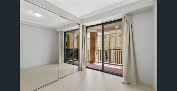 Rare Find - Bright, Oversized One-Bed with Two Balconies + Skyline Views - Photo 1