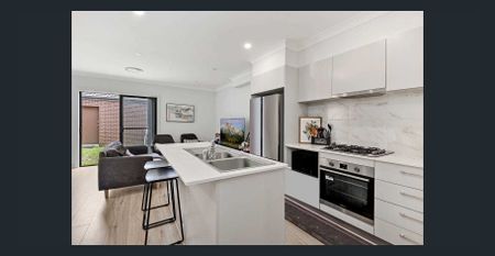 Spacious Modern 4-Bedroom Home in Premier Location | Steps to Park, Shops & Station - Photo 5