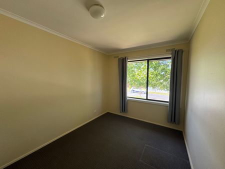 Neat Three-Bedroom Home in Prime Location - Photo 2