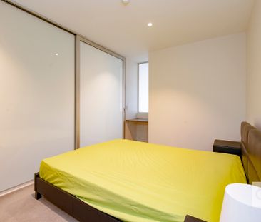 Open the Door to Effortless City Living with Stylish Furnished Comfort - Photo 5