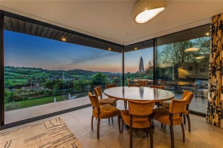 An exceptional contemporary home with quality interiors and landscaped gardens in an elevated position with village and open country views. - Photo 2
