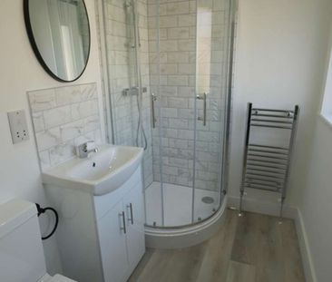 50% Off First Month | Steps From QA Hospital Room 5 - Photo 2