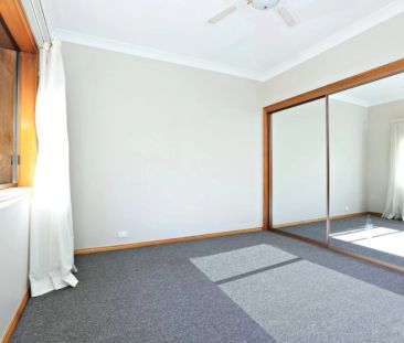 Light-Filled Apartment Offering Comfort and Convenience - Photo 1
