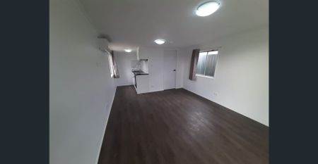 STREET FRONTAGE, PRVIATE ENTRY & CARPORT! - Photo 2