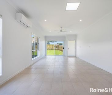 Modern Three-Bedroom Home in a Prime Location - Photo 1