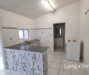 Inconspicuously Spacious home so close to everything. - Photo 1