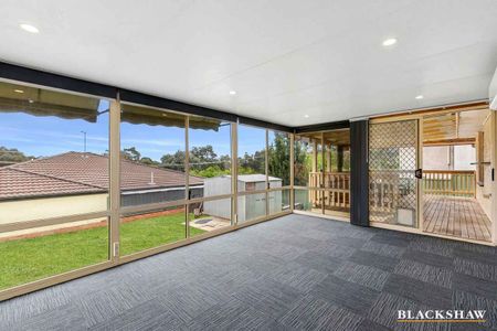 Stylishly Renovated Home with Sunroom Retreat - Photo 2