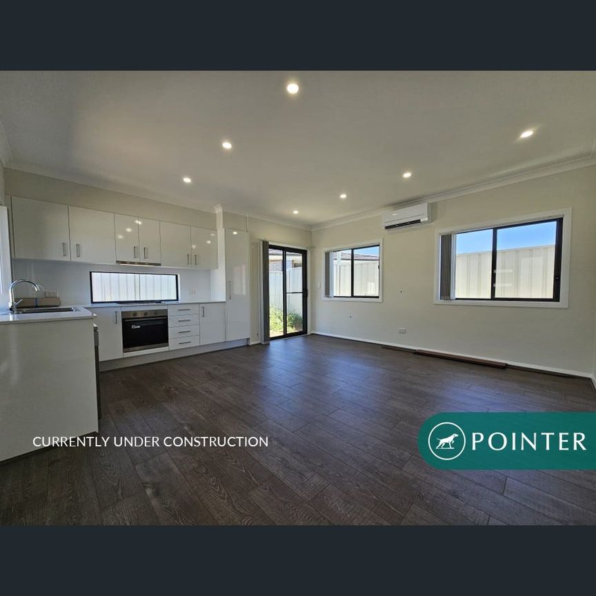 Brand new, with off street parking. - Photo 1