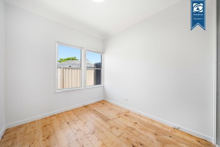 Charming Three-Bedroom Home with Freshly Landscaped Gardens - Photo 4