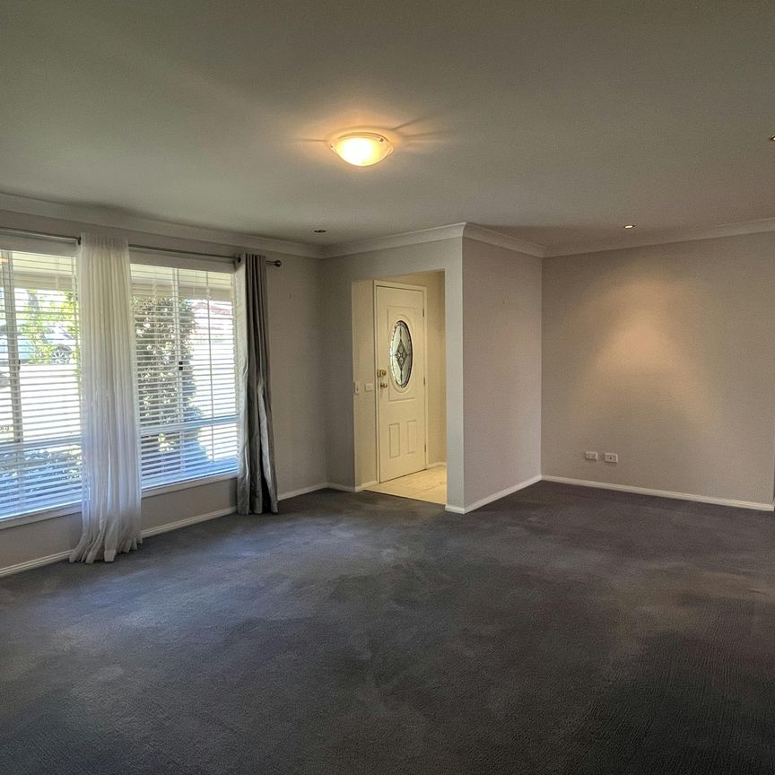 Bright Family Home with Sunroom and Outdoor Living Space - Photo 1