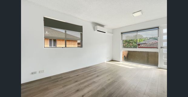 Newly Renovated | Modern Top Floor, 2 Bedroom Unit with Garage - Photo 1