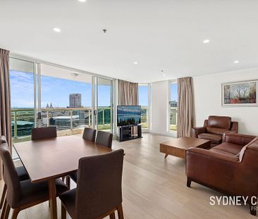 EXQUISITE THREE-BEDROOM APARTMENT WITH STUNNING CITY VIEWS | Furnished - Photo 6