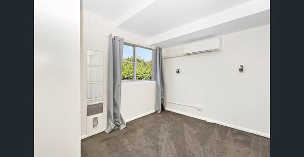 Available NOW: Walk-to-Town Convenience in a Well-Positioned Two-Bed Unit - Photo 1