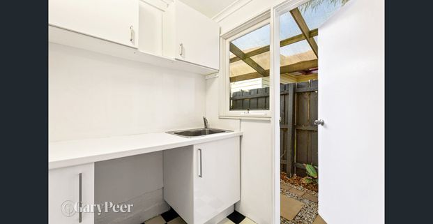 Parkside living and with wrap around courtyard - Photo 1