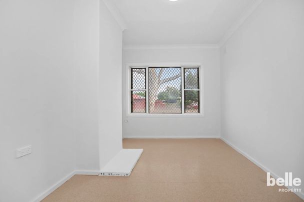 Comfortable 3-Bedroom Home with Spacious Yard in a Convenient Location - Photo 1