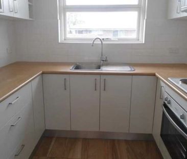 Stylishly Renovated Top Floor Apartment - Photo 1