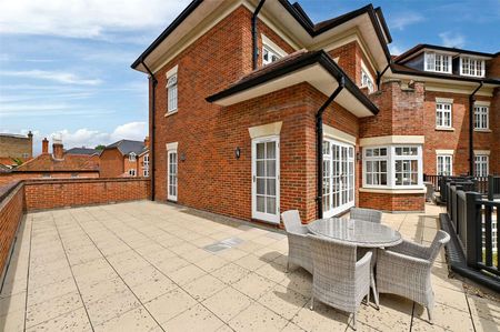 A first floor three bedroom apartment with large wrap around terrace and river views in a secure development with underground parking. - Photo 2