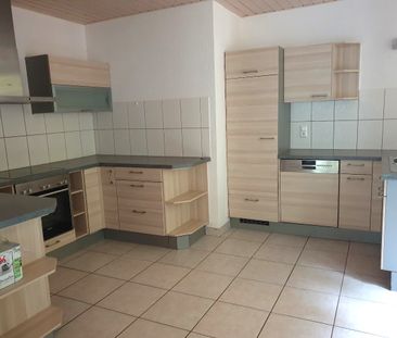 Appartement de 4,5 pièces au 1er étage avec balcon - Photo 1