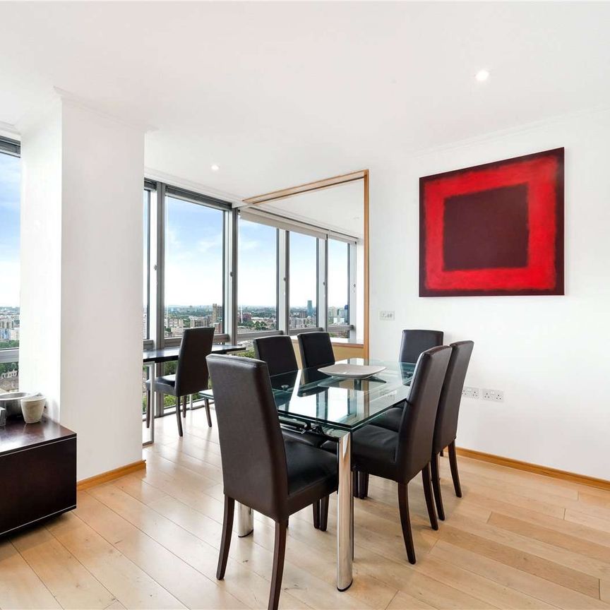 An interior designed 2 bedroom apartment situated on the 26th floor of this striking development located close to heart of Canary Wharf's Business district. - Photo 1