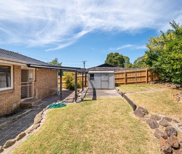 Charming Three-Bedroom Home - Photo 1