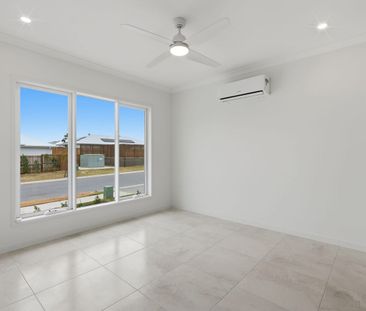 BRAND NEW FAMILY HOME WITH THREE LIVING AREAS! - Photo 6