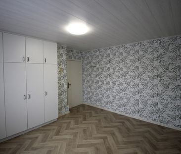 Een woning met 3 slaapkamers, garage en tuin vlakbij het centrum va... - Photo 2