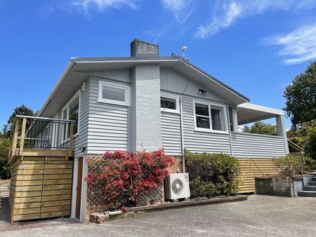 Charming Titirangi 3BR Home w/ Deck - Photo 3