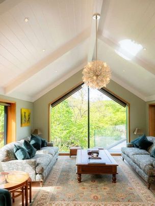 A substantial and beautifully presented four bedroom house, set in an elevated position with valley views. Driveway, large garage workshop with a lift to the li - Photo 1