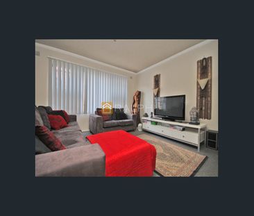 Front facing, 2 bedroom residence with a lock up garage - Photo 2