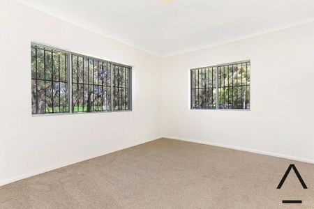 Expansive Six-Bedroom Home in Peaceful Riverside Pocket - Photo 3